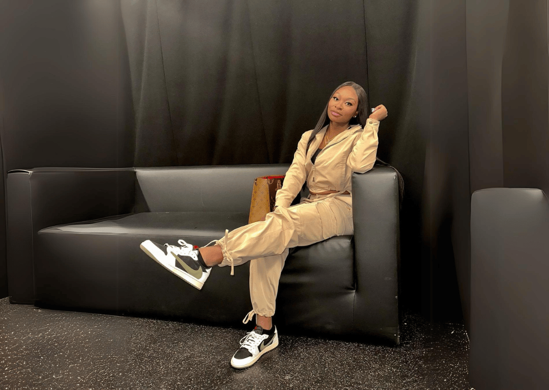 Dana Evans Kicking Her Feet Up In the Olive Travis Scott Jordan 1 Low
