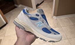 Photos Surface of a Grey and Blue Kith Friends and Family New Balance 993