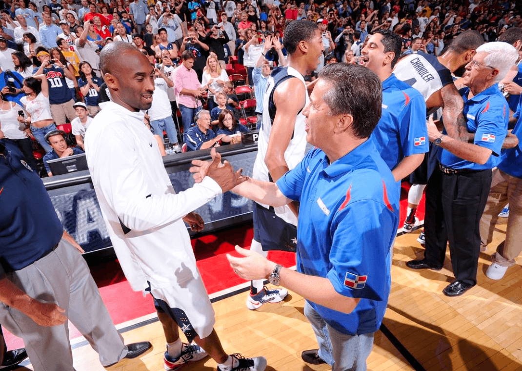 Kobe Bryant (left) with current Kentucky Wildcats Coach John Calipari (right) [Image via Andrew D. Bernstein , Getty]