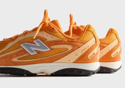 Kith x New Balance 204L Orange Medial