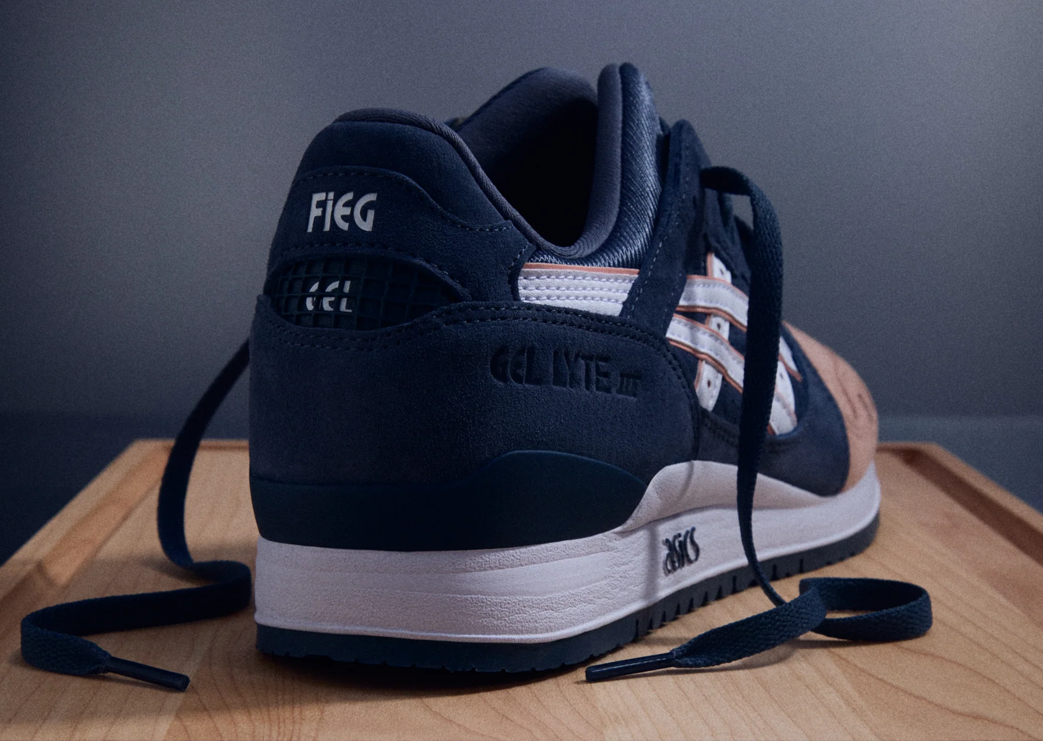 Kith x ASICS Gel-Lyte III Remastered Salmon Toe heel view showing FIEG heel tab and salmon pink accents