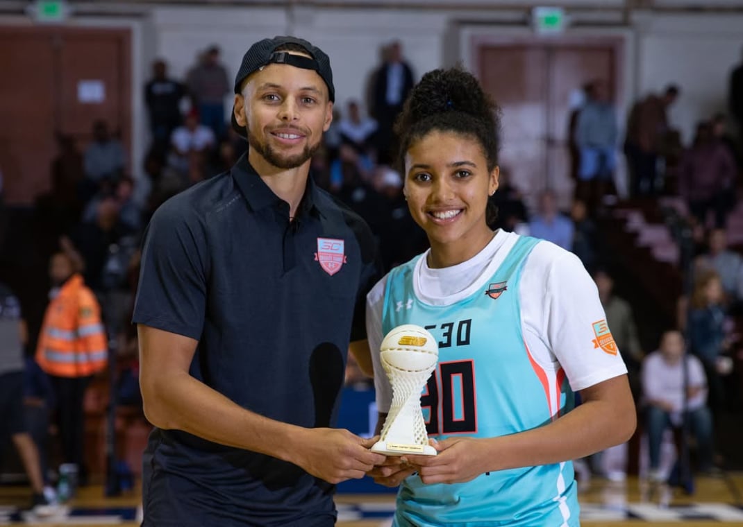 Azzi Fudd with Steph Curry at his Basketball Camp in 2018