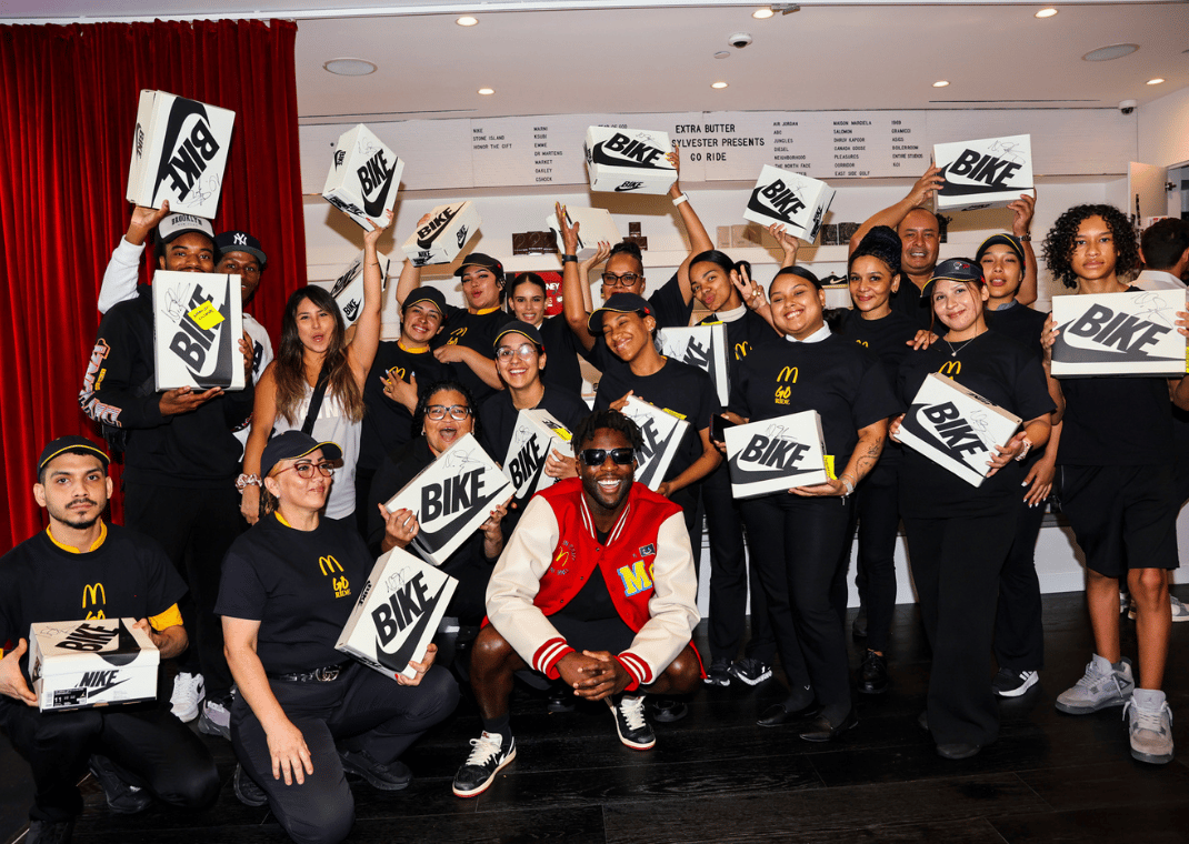 McDonald's crew members receiving pairs of the Nigel Sylvester x Air Jordan 1 Retro Low OG Better With Time