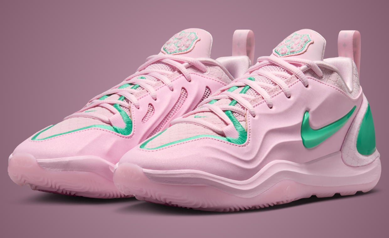 Nike A'Two Pinkies Up in pink and green Alpha Kappa Alpha colors, shown from side angle with embroidered toebox border and green Swoosh detail