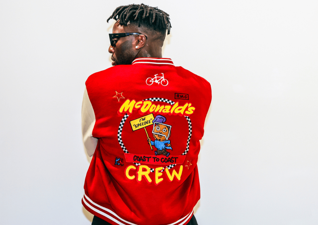 Nigel Sylvester wearing a McDonald's varsity jacket