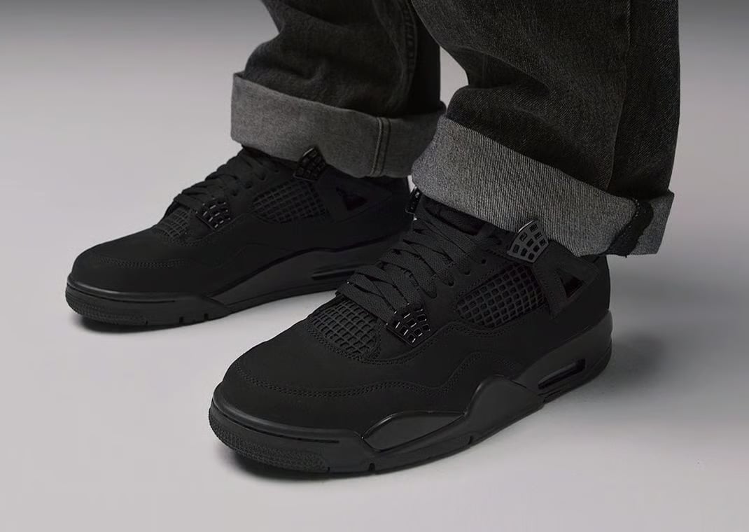 Air Jordan 4 Retro Black Cat on feet