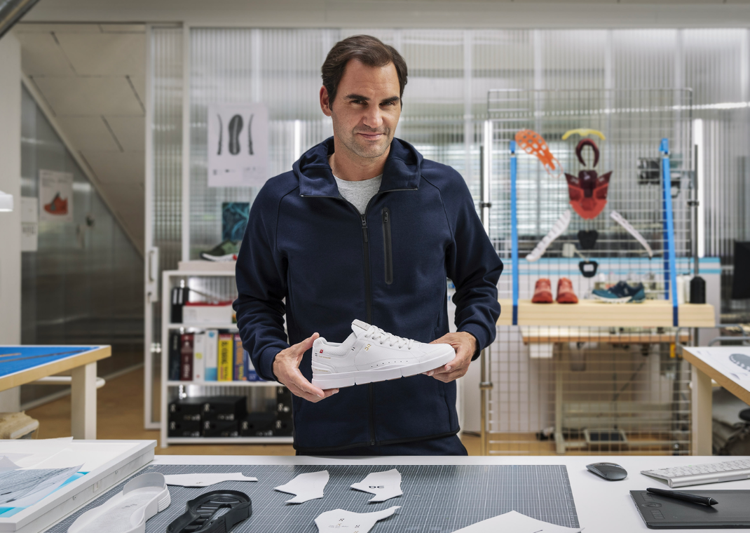 Roger Federer holding his signature On "Roger" model