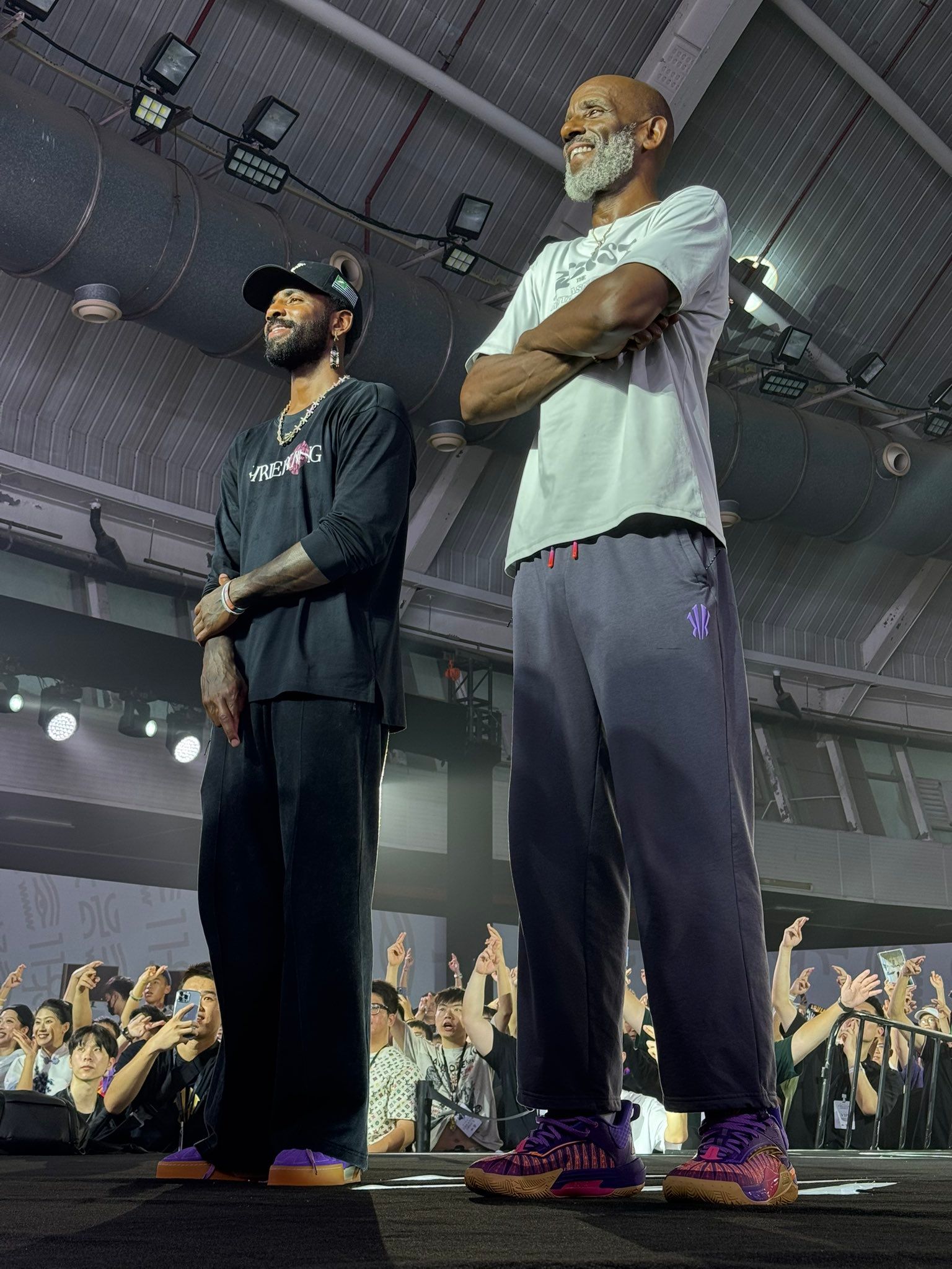 Kyrie and his dad Drederick on stage at the ANTA Creator Office