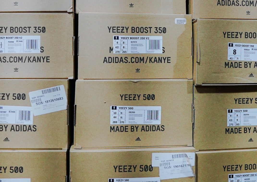Yeezy Boxes Piled Up (Image via Alex Haney | Unsplash)