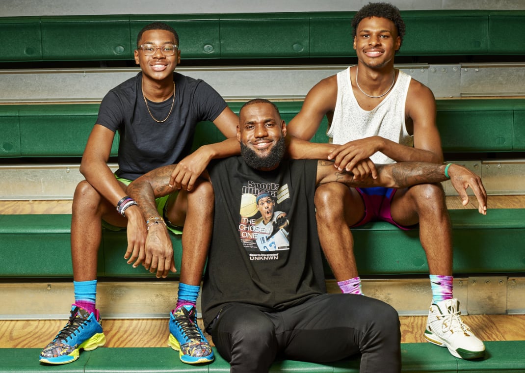 LeBron James with son Bryce (left) and Bronny (right)