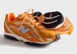 Kith x New Balance 204L Orange Angle