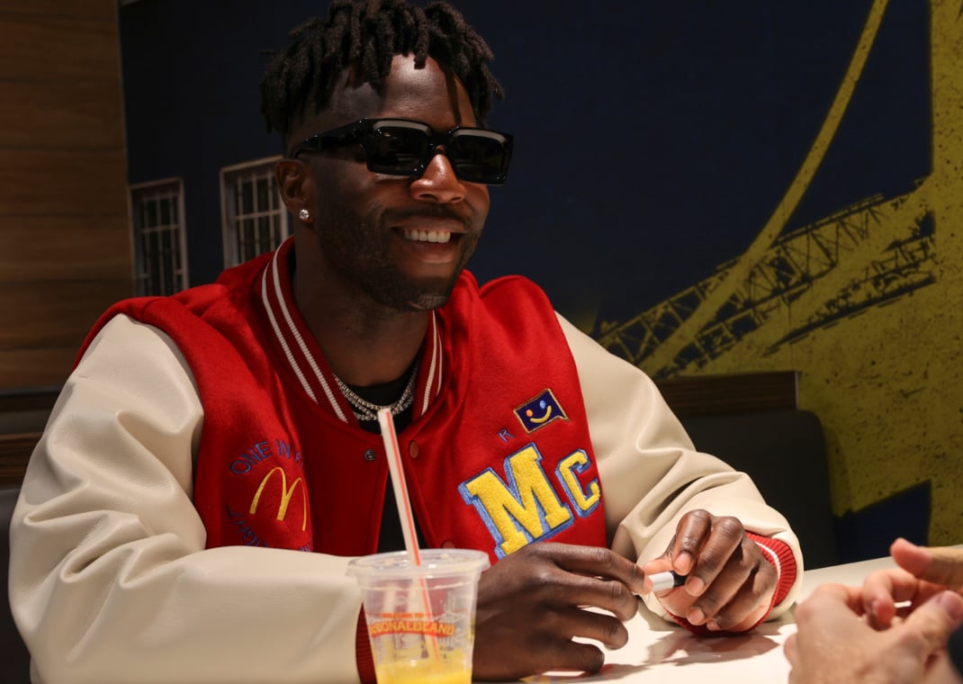 Nigel Sylvester eating breakfast inside McDonald's