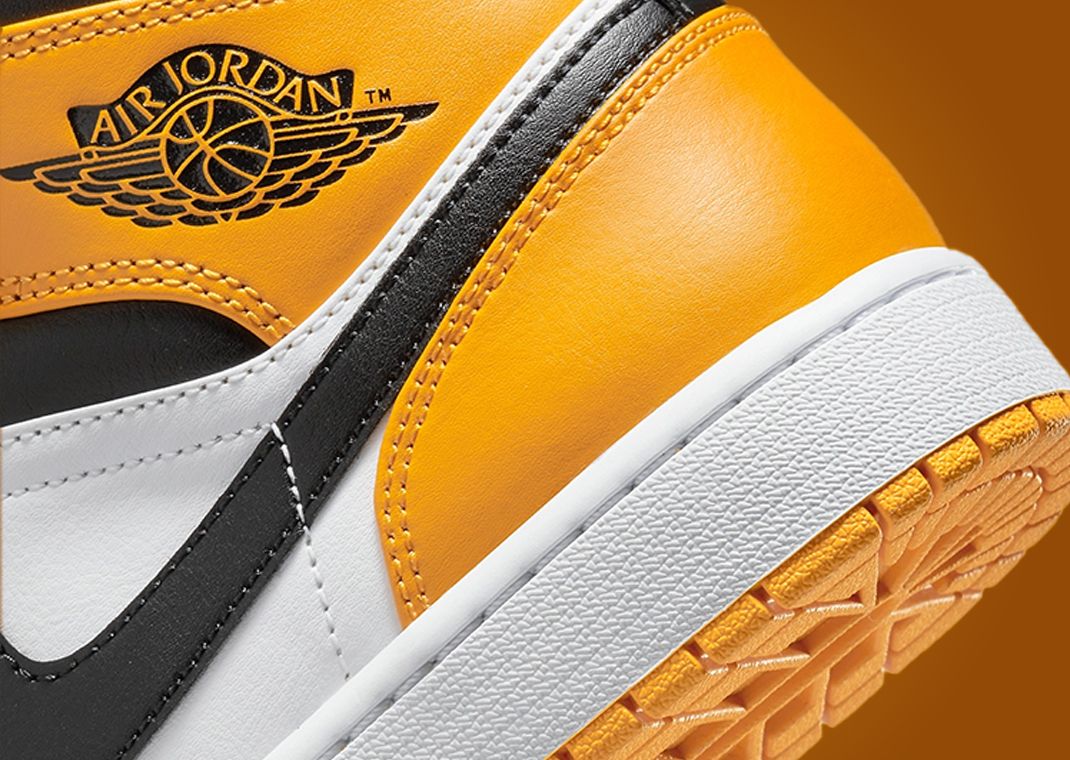 The Air Jordan 1 Mid Appears With A Yellow Toe