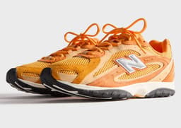 Kith x New Balance 204L Orange Angle