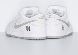 Supreme x Nike SB Dunk Low White Metallic Silver Heel Angle