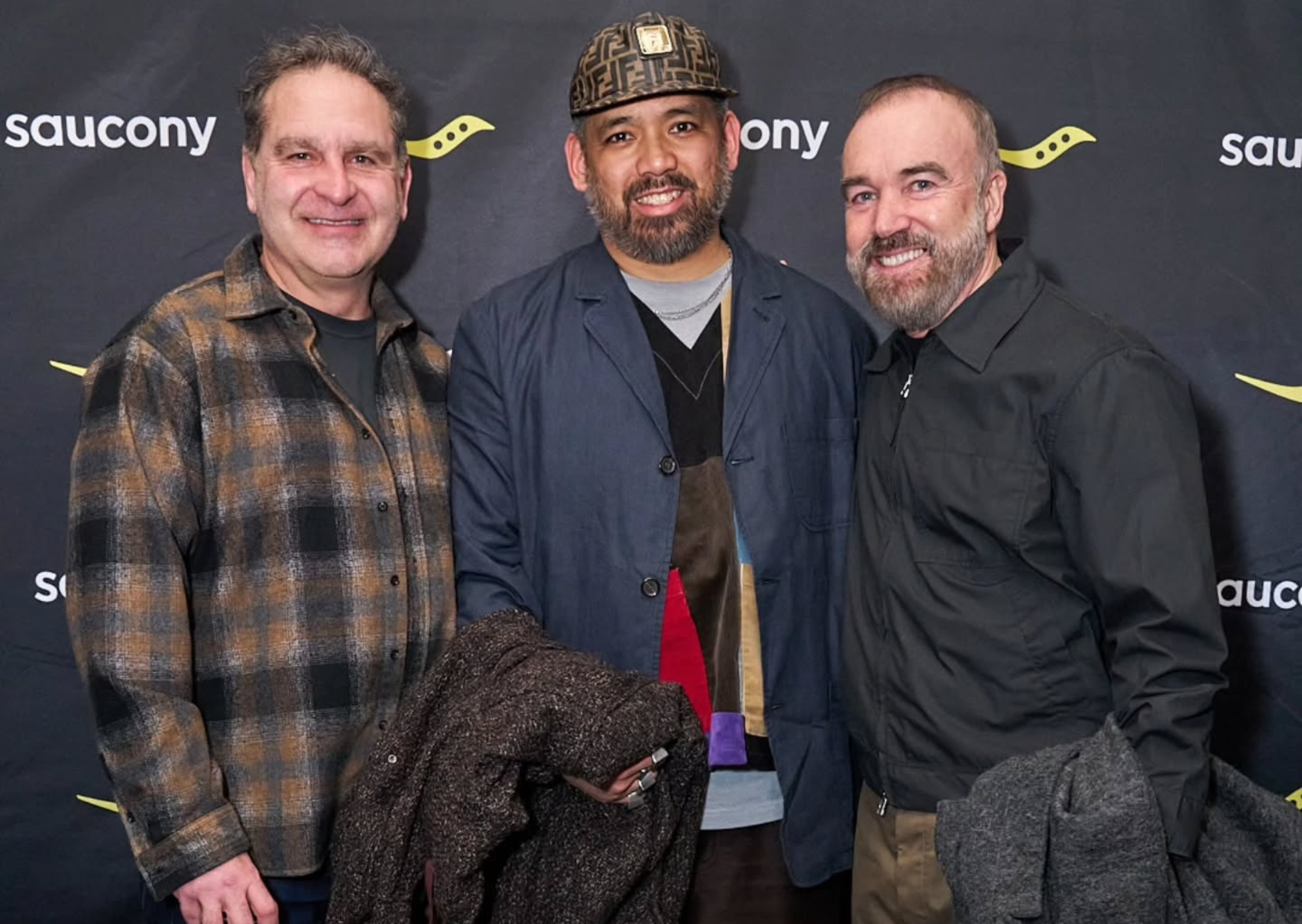 Brian Moore, Chief Product Officer at Saucony (left), Jason Faustino (center), and Rob Griffiths, Global Brand President Saucony (right)