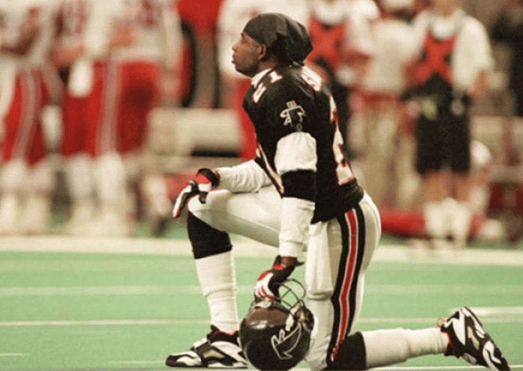 Deion Sanders wearing the Nike Air Diamond Turf