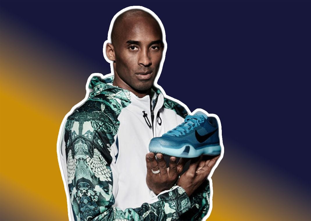 Kobe Bryant holding up the Nike Kobe 10