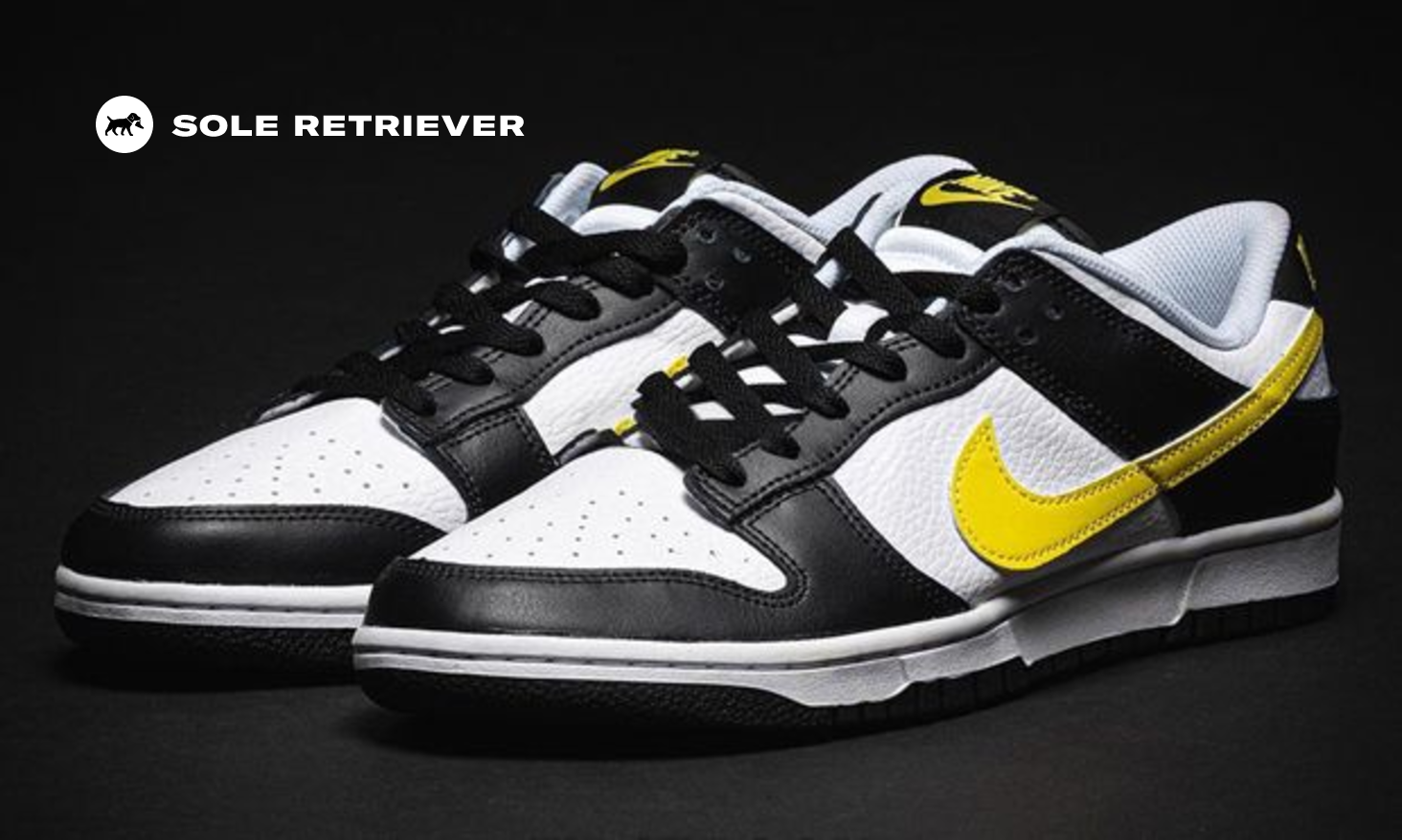 Yellow Branding Details Appear On This Black And White Nike