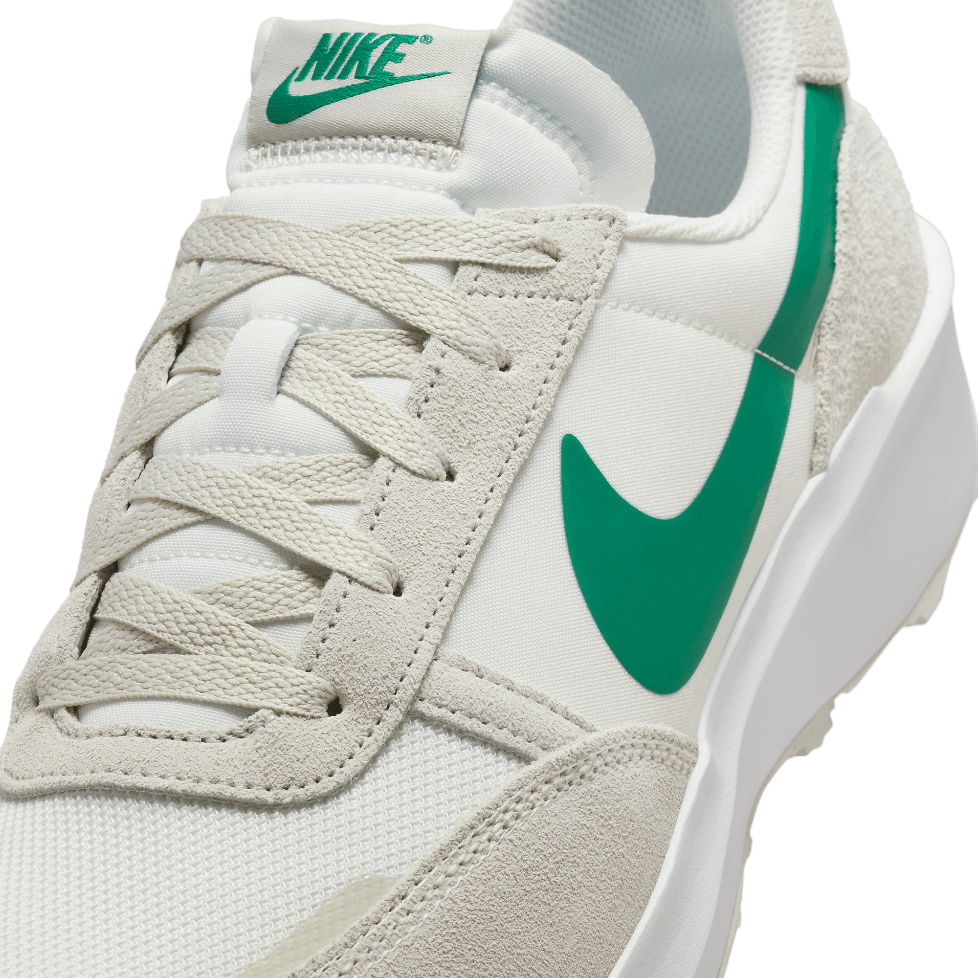 nike outburst trainers in white and green