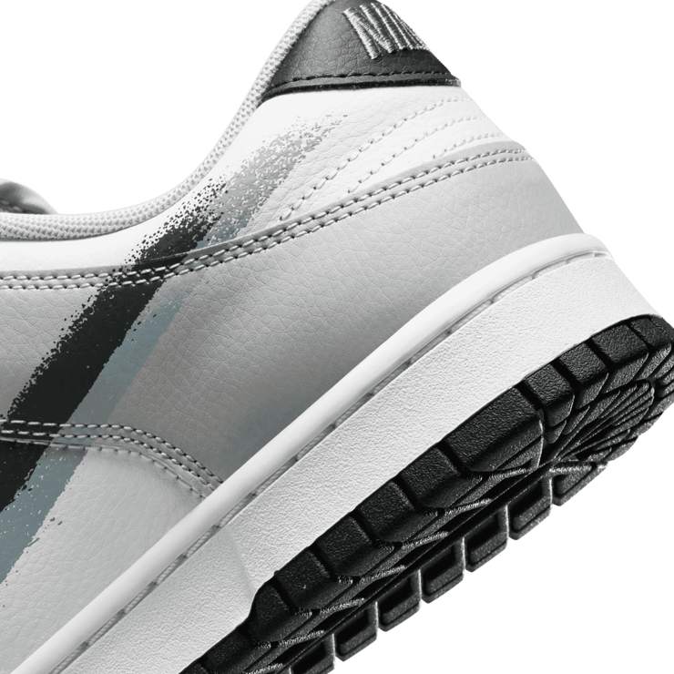 Spray Painted Swooshes Take Over This Nike Dunk Low Spray Painted Swooshes Take Over This Nike Dunk Low