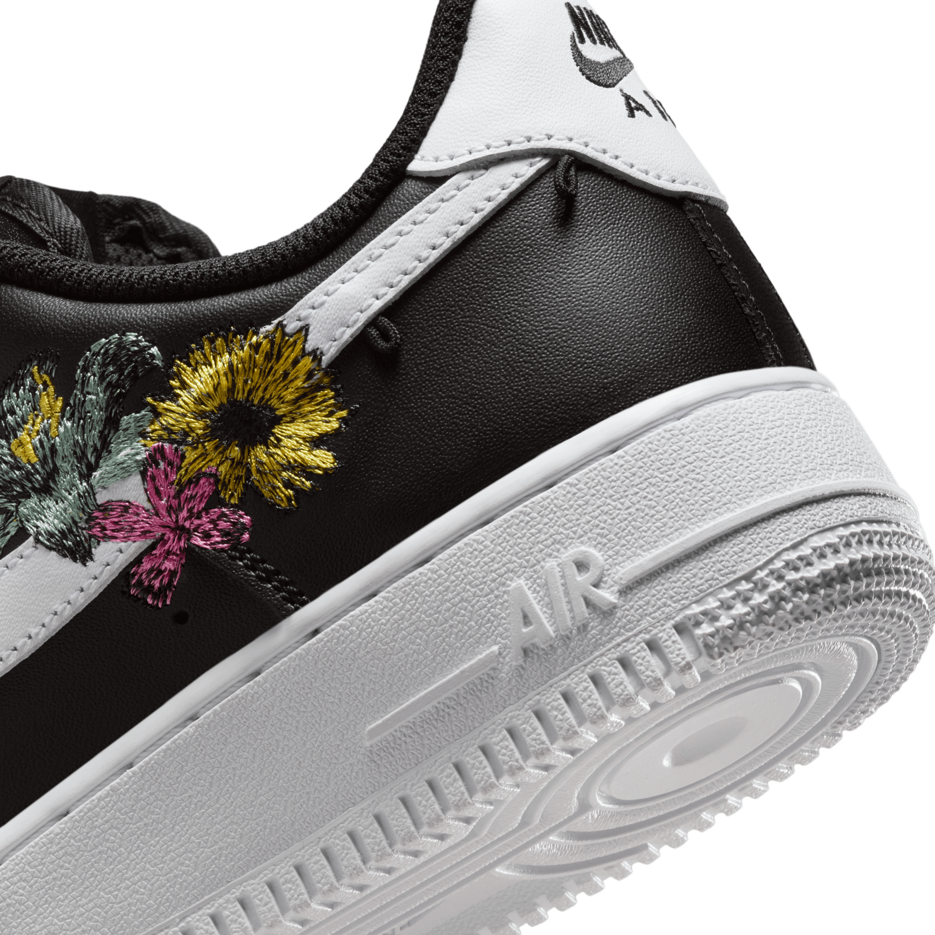 black nike shoes with flowers